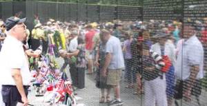 A man looks at the Vietnam Veterans Memorial on Memorial Day 2013: Image source nps.gov
